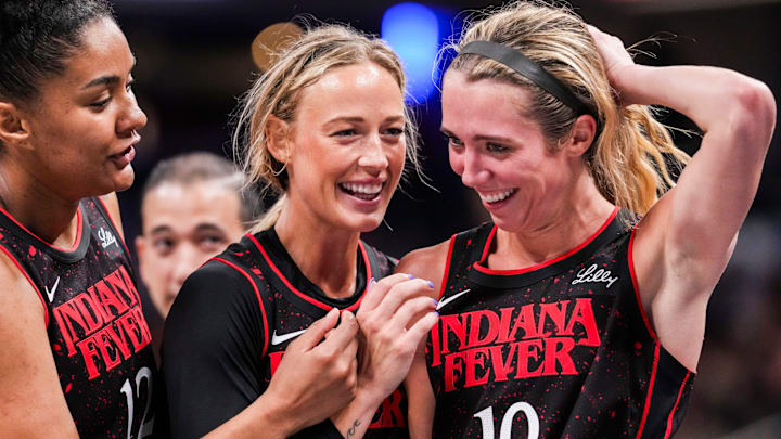 Indiana Fever forward Damiris Dantas, Indiana Fever guard Sophie Cunningham and Lexie Hull huddle up during a WNBA game Indiana Fever forward Damiris Dantas, Indiana Fever guard Sophie Cunningham and Lexie Hull huddle up during a WNBA game