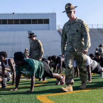 U.S. Army Soldiers from III Armored Corps provide DeSoto High School Football players a basic training style team building exercise in DeSoto, Texas, July 30, 2025. DeSoto High School's football team is known for its strong recent performance, including winning back-to-back state championships in 2022 and 2023.
