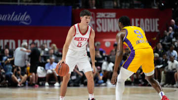 Jul 12, 2024; Las Vegas, NV, USA; Houston Rockets guard Reed Sheppard (15) dribbles the ball against Los Angeles Lakers guard Bronny James (9) during the first half at Thomas & Mack Center. Mandatory Credit: Lucas Peltier-USA TODAY Sports
