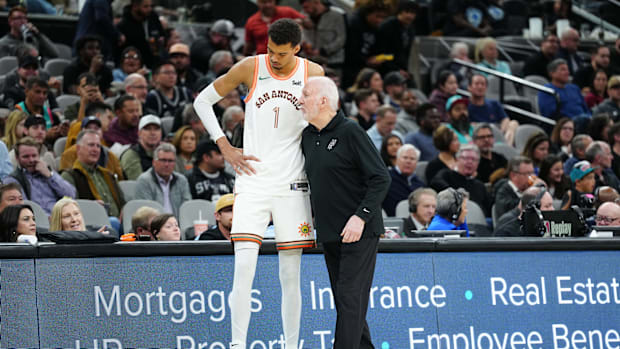 Mar 19, 2024; San Antonio, Texas, USA; San Antonio Spurs center Victor Wembanyama (1) talks with head coach Gregg Popovich in