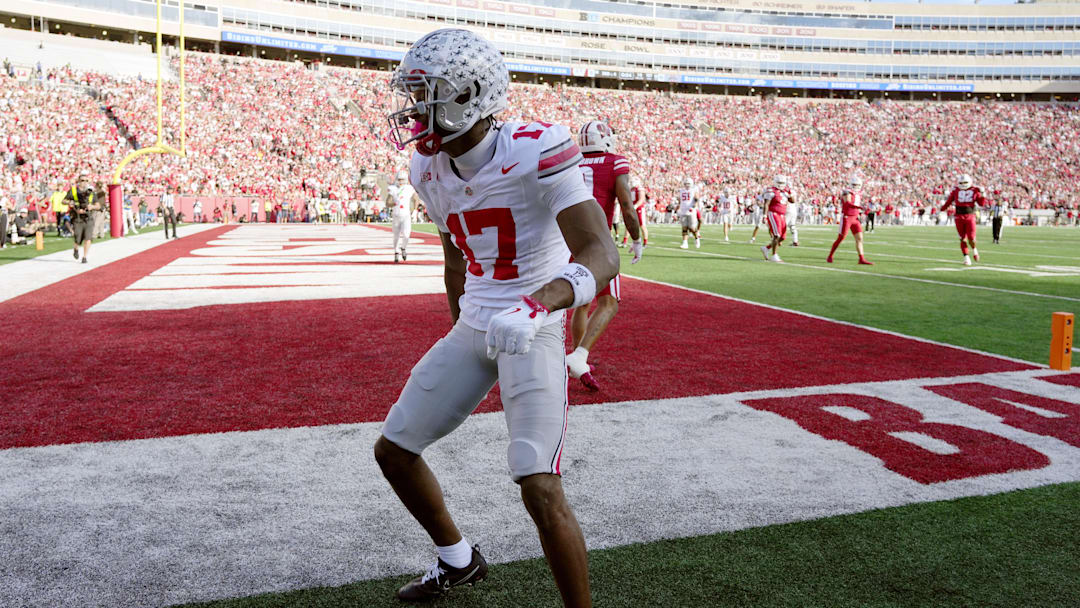 Oct 18, 2025; Madison, Wisconsin, USA; Ohio State Buckeyes wide receiver Carnell Tate (17) celebrates after scoring a touchdown against the Wisconsin Badgers in the first quarter at Camp Randall Stadium. Mandatory Credit: Jeff Hanisch-Imagn Images