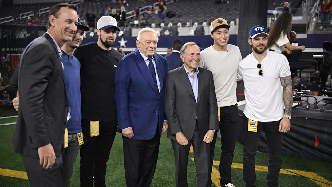 Nov 3, 2025; Arlington, Texas, USA;  From left: Dallas Stars president Brad Alberts, Dallas Stars players Wyatt Johnston and Jamie Benn, Dallas Cowboys owner Jerry Jones, NHL commissioner Gary Bettman, Dallas Stars players Jason Robertson and Tyler Seguin pose for a photo before the game between the Dallas Cowboys and the Arizona Cardinals  after the 2027 Stadium Series announcement at AT&T Stadium. Mandatory Credit: Jerome Miron-Imagn Images