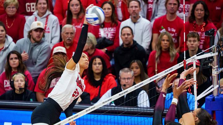 Nebraska Cornhuskers outside hitter Harper Murray (27) attacks against Texas A&M Aggies middle blocker Ifenna Cos-Okpalla (1) and opposite hitter Logan Lednicky (9) during the first set at Bob Devaney Sports Center. Mandatory Credit: Dylan Widger-Imagn Images