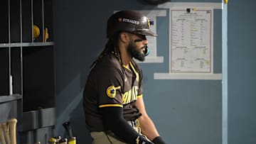 Oct 11, 2024; Los Angeles, California, USA; San Diego Padres outfielder Fernando Tatis Jr. (23) looks on in the dugout in the ninth inning against the Los Angeles Dodgers during game five of the NLDS for the 2024 MLB Playoffs at Dodger Stadium. Mandatory Credit: Jayne Kamin-Oncea-Imagn Images