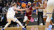 Troy Trojans guard Tayton Conerway (12) drives to the hoop past Kentucky Wildcats guard Collin Chandler (5) and forward Brandon Garrison (10) during the first half at Fiserv Forum.