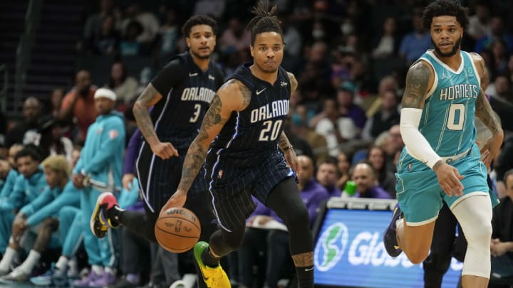 Apr 7, 2022; Charlotte, North Carolina, USA; Orlando Magic guard Markelle Fultz (20) brings the ball up court against the Charlotte Hornets during the second half at Spectrum Center. Mandatory Credit: Jim Dedmon-USA TODAY Sports