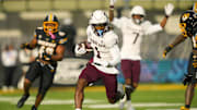 Nov 8, 2025; Columbia, Missouri, USA; Texas A&M Aggies wide receiver Mario Craver (1) runs with the ball during the first half against the Missouri Tigers at Faurot Field at Memorial Stadium. Mandatory Credit: Jay Biggerstaff-Imagn Images
