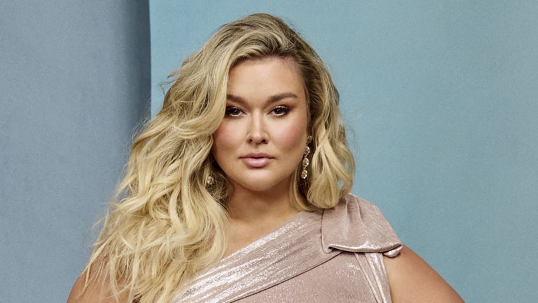 Hunter McGrady was photographed by Yu Tsai in Hollywood, Fla. Dress by Tadashi Shoji. Shoes by Britt Netta. Jewelry by Charlie Lapson and Ettika.