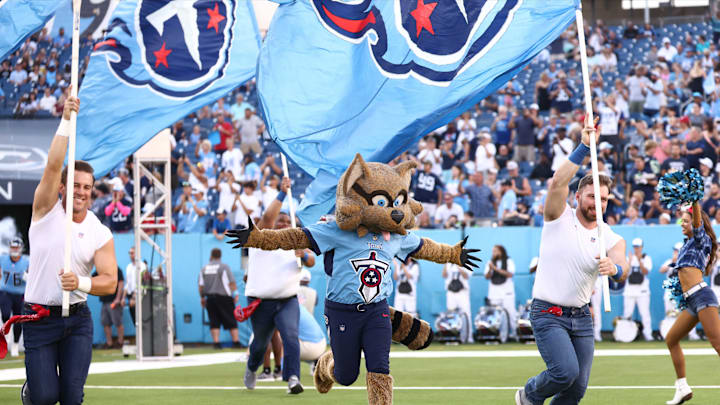 Aug 17, 2024; Nashville, Tennessee, USA; Tennessee Titans mascot T-Rac runs onto the field before the game against the Seattle Seahawks at Nissan Stadium. Mandatory Credit: Casey Gower-Imagn Images Aug 17, 2024; Nashville, Tennessee, USA; Tennessee Titans mascot T-Rac runs onto the field before the game against the Seattle Seahawks at Nissan Stadium. Mandatory Credit: Casey Gower-Imagn Images