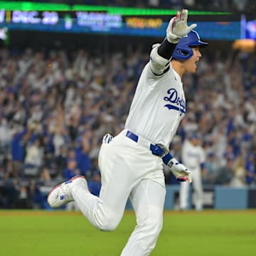 Oct 27, 2025; Los Angeles, California, USA; Los Angeles Dodgers two-way player Shohei Ohtani (17) runs after hitting a solo home run against the Toronto Blue Jays in the seventh inning during game three of the 2025 MLB World Series at Dodger Stadium. Mandatory Credit: Jayne Kamin-Oncea-Imagn Images