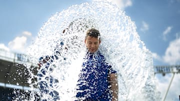 May 8, 2025; Kansas City, Missouri, USA; Kansas City Royals starting pitcher Kris Bubic (50) is doused by shortstop Bobby Witt Jr. (7) after defeating the Chicago White Sox at Kauffman Stadium. Mandatory Credit: Jay Biggerstaff-Imagn Images