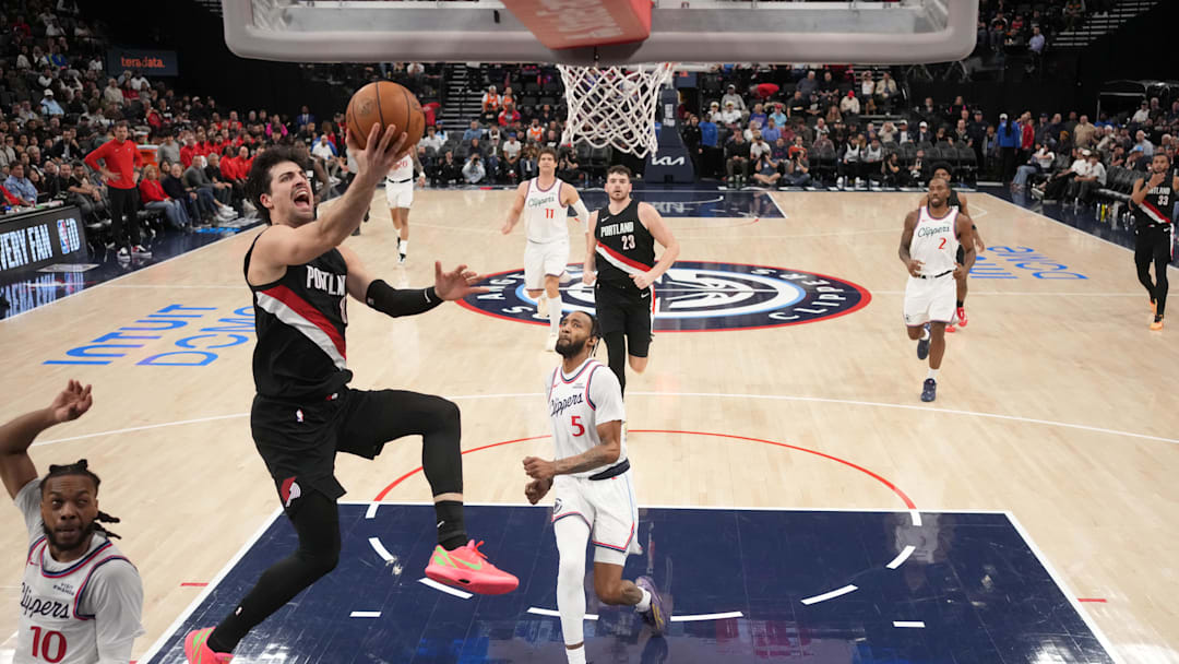 Mar 31, 2026; Inglewood, California, USA; Portland Trail Blazers forward Deni Avdija (8) shoots the ball against LA Clippers guard Darius Garland (10) and forward Derrick Jones Jr. (5) in the second half at Intuit Dome. Mandatory Credit: Kirby Lee-Imagn Images