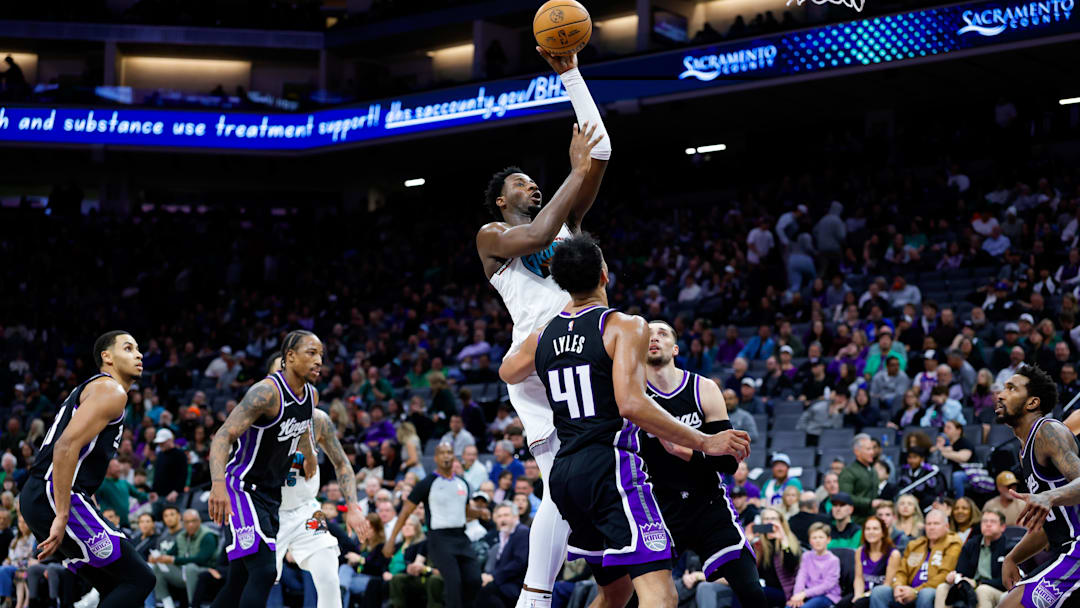 Mar 17, 2025; Sacramento, California, USA; Memphis Grizzlies forward Jaren Jackson Jr. (13) shoots the ball against Sacramento Kings forward Trey Lyles (41) during the fourth quarter at Golden 1 Center. Mandatory Credit: Sergio Estrada-Imagn Images