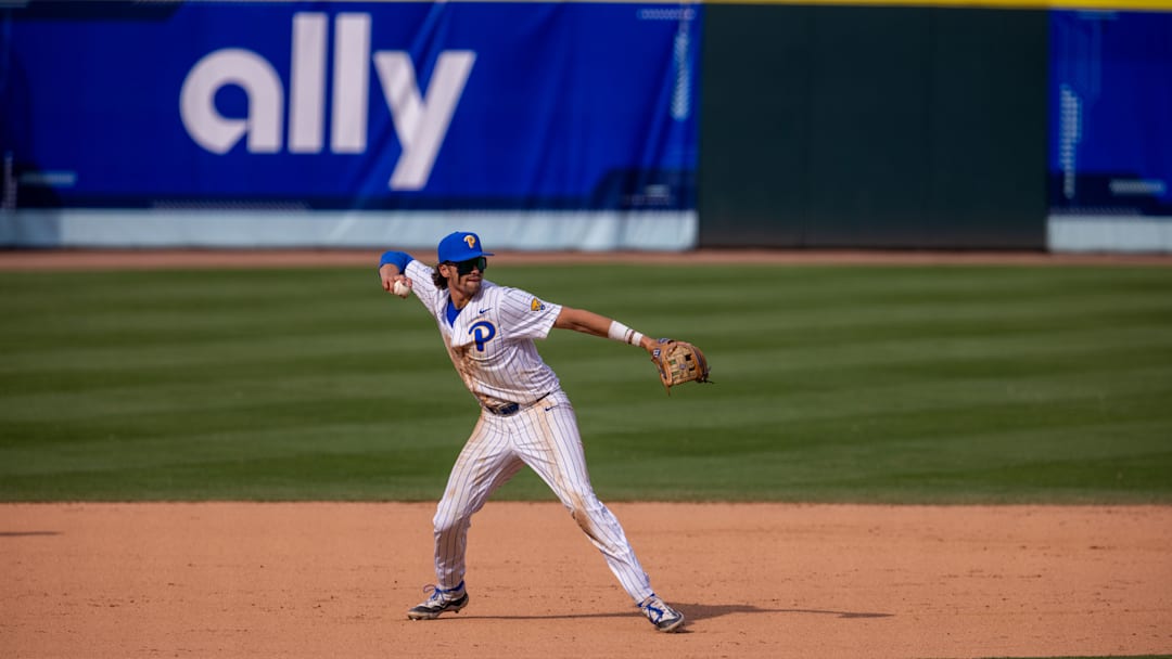 May 23, 2024; Charlotte, NC, USA; Pittsburgh Panthers infielder Ryan Zuckerman (14) field s the ground ball in the ninth inning against the North Carolina Tar Heels during the ACC Baseball Tournament at Truist Field. 