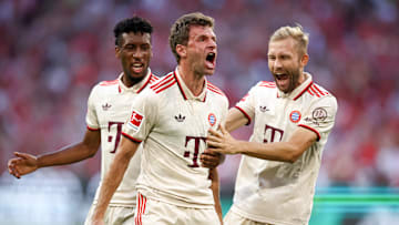 Thomas Muller celebrating after scoring for Bayern Munich against Freiburg.