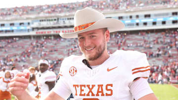 Nov 16, 2024; Fayetteville, Arkansas, USA; Texas Longhorns quarterback Quinn Ewers (3) celebrates after the game against the Arkansas Razorbacks at Donald W. Reynolds Razorback Stadium. Texas won 20-10. Mandatory Credit: Nelson Chenault-Imagn Images