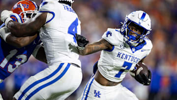 Oct 19, 2024; Gainesville, Florida, USA; Kentucky Wildcats wide receiver Barion Brown (7) pushes past Kentucky Wildcats running back Chip Trayanum (4) against the Florida Gators during the second half at Ben Hill Griffin Stadium. Mandatory Credit: Matt Pendleton-Imagn Images