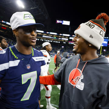 Aug 24, 2024; Seattle, Washington, USA; Seattle Seahawks quarterback Geno Smith (7) greets Cleveland Browns quarterback Deshaun Watson (4) following the fourth quarter at Lumen Field. Mandatory Credit: Joe Nicholson-USA TODAY Sports