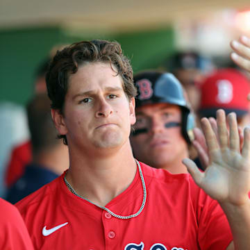 Boston Red Sox outfielder Roman Anthony (48) is congratulated after he scored a run against the Philadelphia Phillies  during the third inning  at BayCare Ballpark on Feb. 28.