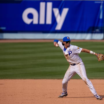 May 23, 2024; Charlotte, NC, USA; Pittsburgh Panthers infielder Ryan Zuckerman (14) field s the ground ball in the ninth inning against the North Carolina Tar Heels during the ACC Baseball Tournament at Truist Field. 