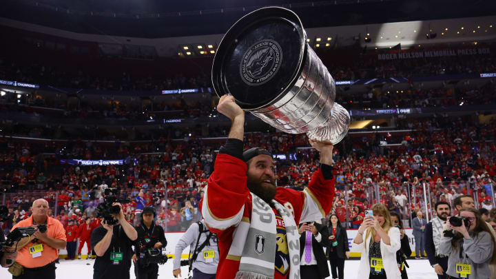 Jun 24, 2024; Sunrise, Florida, USA; Florida Panthers defenseman Aaron Ekblad (5) hoists the Stanley Cup after defeating Edmonton Oilers in game seven of the 2024 Stanley Cup Final at Amerant Bank Arena. Mandatory Credit: Sam Navarro-USA TODAY Sports