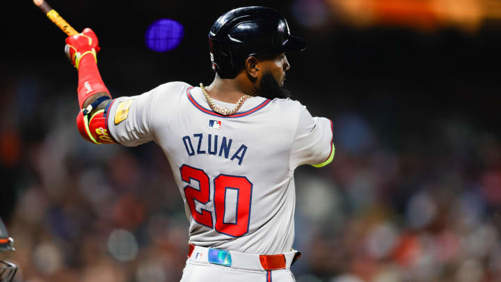 Aug 12, 2024; San Francisco, California, USA; Atlanta Braves designated hitter Marcell Ozuna (20) hits a single during the eighth inning against the San Francisco Giants at Oracle Park. Mandatory Credit: Sergio Estrada-USA TODAY Sports