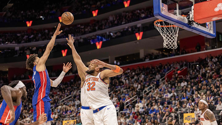Apr 10, 2025; Detroit, Michigan, USA; Detroit Pistons guard Cade Cunningham (2) shoots the ball over New York Knicks center Karl-Anthony Towns (32) during the second half at Little Caesars Arena. Mandatory Credit: David Reginek-Imagn Images Apr 10, 2025; Detroit, Michigan, USA; Detroit Pistons guard Cade Cunningham (2) shoots the ball over New York Knicks center Karl-Anthony Towns (32) during the second half at Little Caesars Arena. Mandatory Credit: David Reginek-Imagn Images