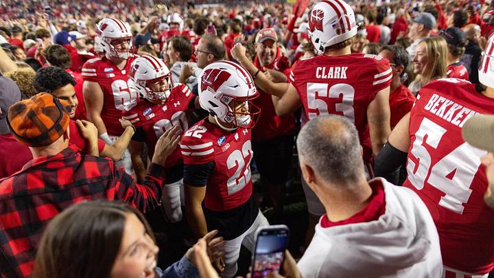 Oct 24, 2026; Madison, Wisconsin, USA;  Wisconsin Badgers students and fans rush the field at Camp Randall Stadium after the Badgers victory over the USC Trojans.  Mandatory Credit: Anthony Wahl-Imagn Images