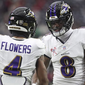 Dec 15, 2024; Houston, Texas, USA; Baltimore Ravens quarterback Lamar Jackson (8) shakes hands with wide receiver Zay Flowers (4) before the game against the Houston Texans at NRG Stadium. Mandatory Credit: Troy Taormina-Imagn Images