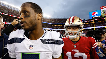 Seattle Seahawks quarterback Geno Smith (L) and San Francisco 49ers quarterback Brock Purdy (R)