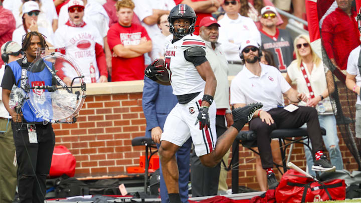 Oct 19, 2024; Norman, Oklahoma, USA;  South Carolina Gamecocks defensive back Nick Emmanwori (7) returns an interception for a touchdown during the first half against the Oklahoma Sooners at Gaylord Family-Oklahoma Memorial Stadium. Mandatory Credit: Kevin Jairaj-Imagn Images