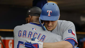May 10, 2025; Detroit, Michigan, USA;  Texas Rangers shortstop Corey Seager (5) receives congratulations from teammates after he hits a home run in the first inning against the Detroit Tigers at Comerica Park. Mandatory Credit: Rick Osentoski-Imagn Images