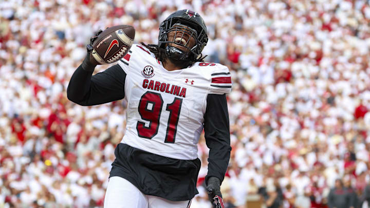 Oct 19, 2024; Norman, Oklahoma, USA; South Carolina Gamecocks defensive tackle Tonka Hemingway (91) reacts after returning a fumble for a touchdown during the first half against the Oklahoma Sooners at Gaylord Family-Oklahoma Memorial Stadium. Mandatory Credit: Kevin Jairaj-Imagn Images Oct 19, 2024; Norman, Oklahoma, USA; South Carolina Gamecocks defensive tackle Tonka Hemingway (91) reacts after returning a fumble for a touchdown during the first half against the Oklahoma Sooners at Gaylord Family-Oklahoma Memorial Stadium. Mandatory Credit: Kevin Jairaj-Imagn Images