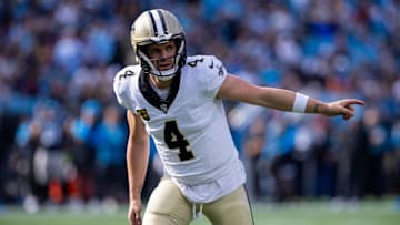 Nov 3, 2024; Charlotte, North Carolina, USA; New Orleans Saints quarterback Derek Carr (4) lines up outside against the Carolina Panthers during the second quarter at Bank of America Stadium. Mandatory Credit: Scott Kinser-Imagn Images