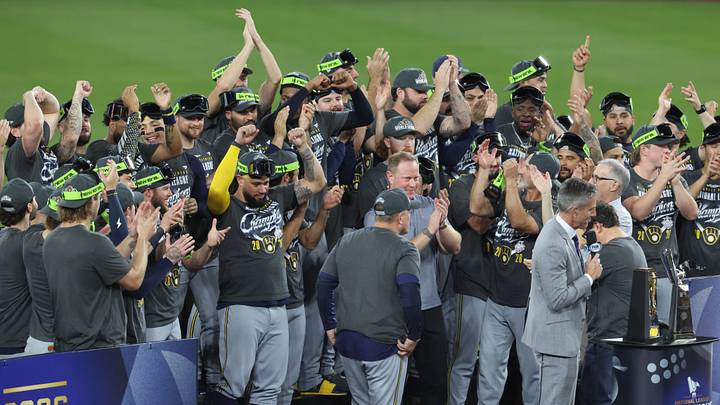 Oct 15, 2026; Los Angeles, California, USA;  Milwaukee Brewers players and coaches celebrate winning the NLCS for the 2026 MLB Playoffs against the Los Angeles Dodgers at Uniqlo Field at Dodger Stadium.  Mandatory Credit: Kiyoshi Mio-Imagn Images