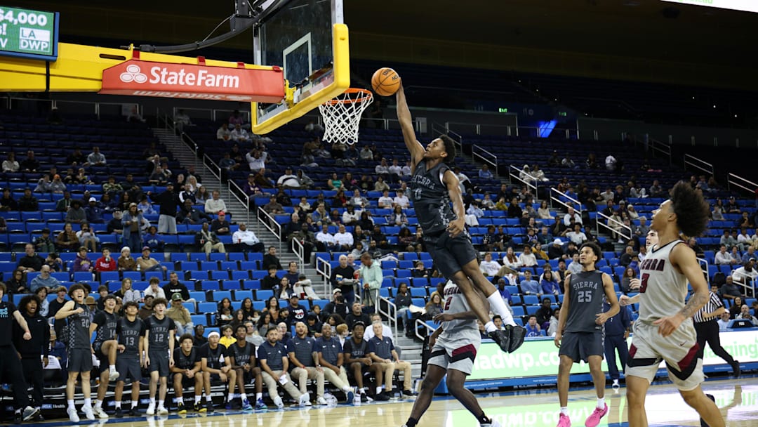 Brandon McCoy Jr. rises for a one-handed dunk against JSerra at Pauley Pavilion on November 22, 2025. Brandon McCoy Jr. rises for a one-handed dunk against JSerra at Pauley Pavilion on November 22, 2025.