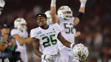 Sep 16, 2023; Stanford, California, USA; Sacramento State Hornets running back Elijah Tau-Tolliver (25) celebrates after a touchdown during the fourth quarter against the Stanford Cardinal at Stanford Stadium. Mandatory Credit: Sergio Estrada-Imagn Images