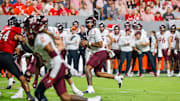 Sep 27, 2025; Raleigh, N.C.; Virginia Tech quarterback Kyron Drones (1) with the ball during the first half of the game against NC State.
