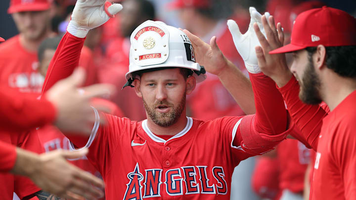 Tampa, FL, USA; Los Angeles Angels outfielder Taylor Ward (3) is congratulated in the dugout after he hit a home run against the Tampa Bay Rays during the first inning at George M. Steinbrenner Field. Tampa, FL, USA; Los Angeles Angels outfielder Taylor Ward (3) is congratulated in the dugout after he hit a home run against the Tampa Bay Rays during the first inning at George M. Steinbrenner Field.