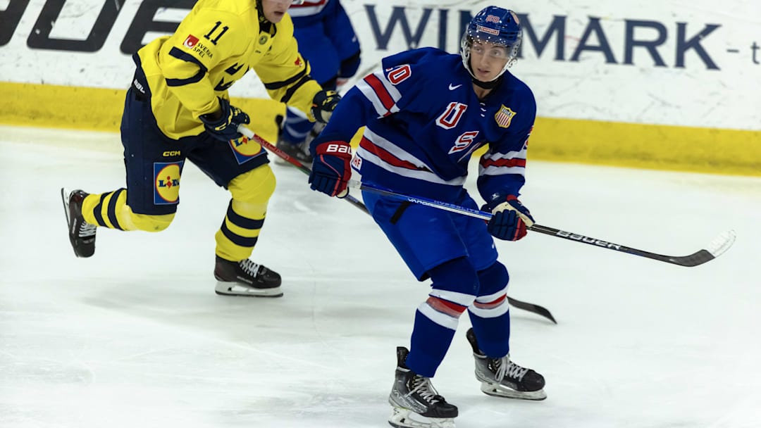 Aug 2, 2024; Plymouth, MI, USA; USA’s forward Chris Pelosi (20) follows the play in front of Sweden's forward Lucas Pettersson (11) during the second period of the 2024 World Junior Summer Showcase at USA Hockey Arena. Mandatory Credit: David Reginek-Imagn Images Aug 2, 2024; Plymouth, MI, USA; USA’s forward Chris Pelosi (20) follows the play in front of Sweden's forward Lucas Pettersson (11) during the second period of the 2024 World Junior Summer Showcase at USA Hockey Arena. Mandatory Credit: David Reginek-Imagn Images