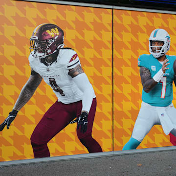 A graphic with images of Washington Commanders linebacker Frankie Luvu (4) and Miami Dolphins quarterback Tua Tagovailoa (1) at Santiago Bernabeu Stadium, the site of the 2025 NFL Madrid Game.