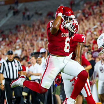 Aug 30, 2024; Norman, Oklahoma, USA;  Oklahoma Sooners running back Taylor Tatum (8) scores a touchdown during the second half against the Temple Owls at Gaylord Family-Oklahoma Memorial Stadium. Mandatory Credit: Kevin Jairaj-Imagn Images