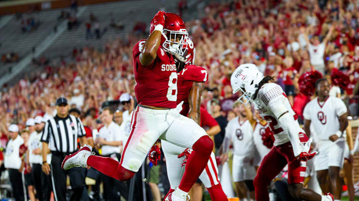 Aug 30, 2024; Norman, Oklahoma, USA;  Oklahoma Sooners running back Taylor Tatum (8) scores a touchdown during the second half against the Temple Owls at Gaylord Family-Oklahoma Memorial Stadium. Mandatory Credit: Kevin Jairaj-Imagn Images