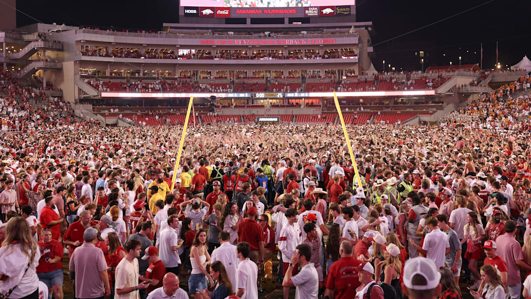 Arkansas Razorbacks fans celebrate in front of the downed goal posts after the game against the Tennessee Volunteers at  Razorback Stadium. Arkansas won 19-14. 