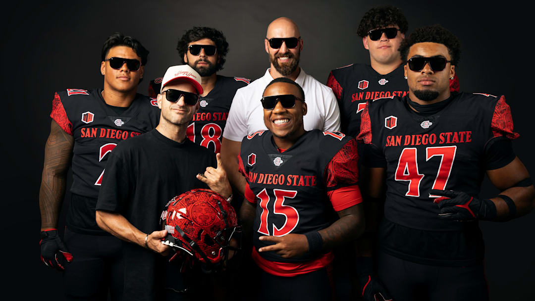 San Diego State Aztecs football players, head coach Sean Lewis and Blenders Eyewear founder Chase Fisher showing off the new sunglasses from the 'Be The A1pha' launch.