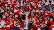Jun 24, 2024; Sunrise, Florida, USA; The Florida Panthers pose with the cup for a team photo after winning game seven of the 2024 Stanley Cup Final against the Edmonton Oilers at Amerant Bank Arena. Mandatory Credit: Sam Navarro-Imagn Images