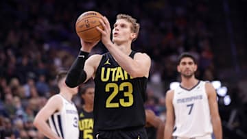 Oct 23, 2024; Salt Lake City, Utah, USA; Utah Jazz forward Lauri Markkanen (23) shoots a technical foul free throw against the Memphis Grizzlies during the second quarter at Delta Center. Mandatory Credit: Chris Nicoll-Imagn Images