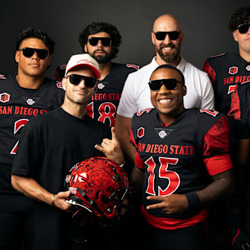 San Diego State Aztecs football players, head coach Sean Lewis and Blenders Eyewear founder Chase Fisher showing off the new sunglasses from the 'Be The A1pha' launch.