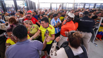 Jul 14, 2024; Miami, FL, USA;  fans rush the gates before the Copa America Final match between Argentina and Colombia at Hard Rock Stadium. Mandatory Credit: Nathan Ray Seebeck-USA TODAY Sports