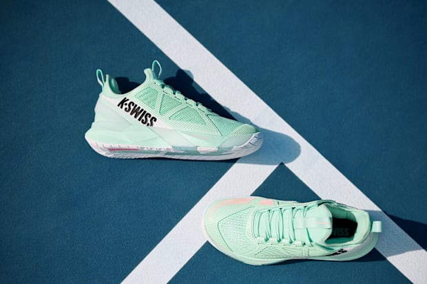 Side view of green K-SWISS tennis shoes.